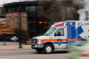 Ambulance driving through a city street