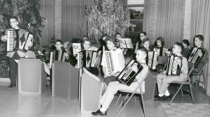 Group of young accordion players performing in the OMRF lobby.
