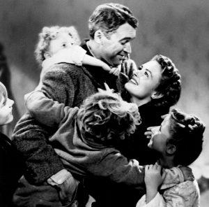 Snapshot from "It's a Wonderful Life" of a family group hug.